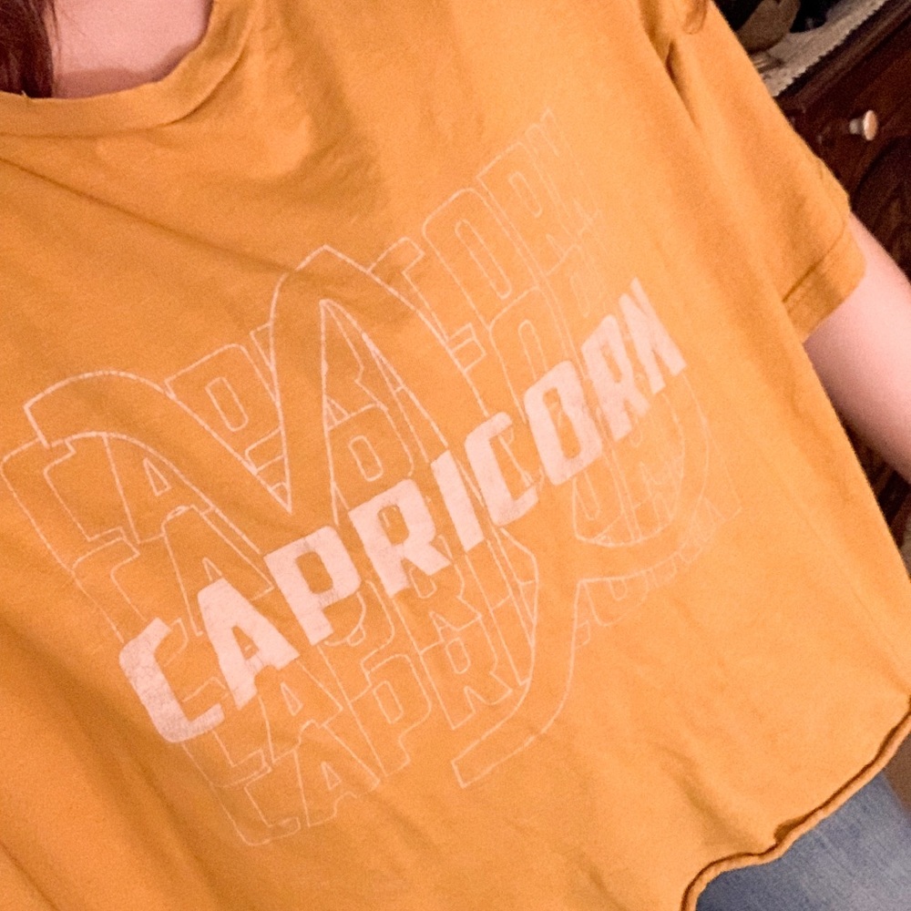 SOLD Arie Capricorn Mustard Yellow Flowy Graphic Tee